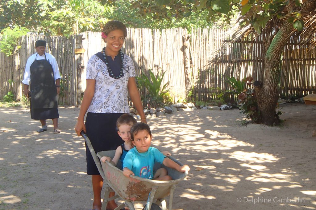 Kids in wheelbarrow in Fiji