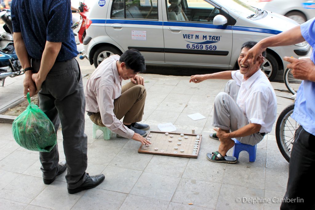 Man Playing Chess in Street in Hanoi