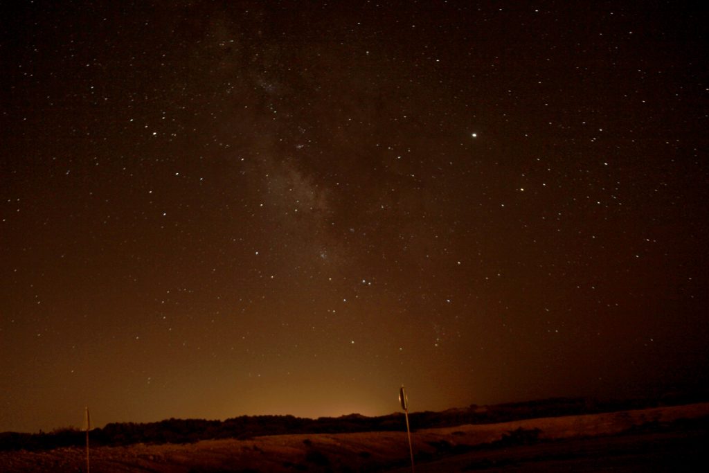 Night sky with a lot of start orange sky in Portugal