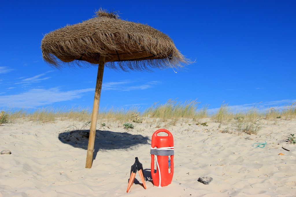 life buoy with umbrella on the beach in Portugal